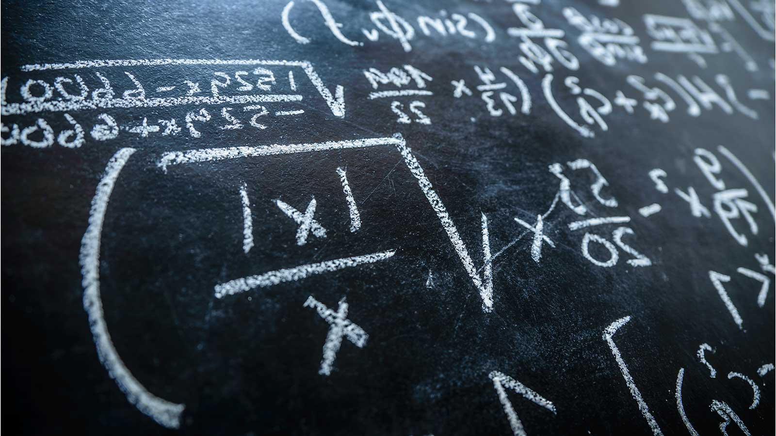 Equation on blackboard representing Applied Mathematics and 统计数据 program at Clarkson